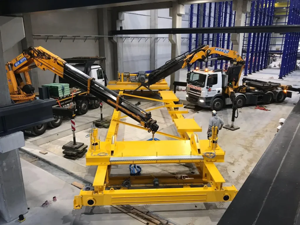 Montage van de rolbruggen met laadkranen
